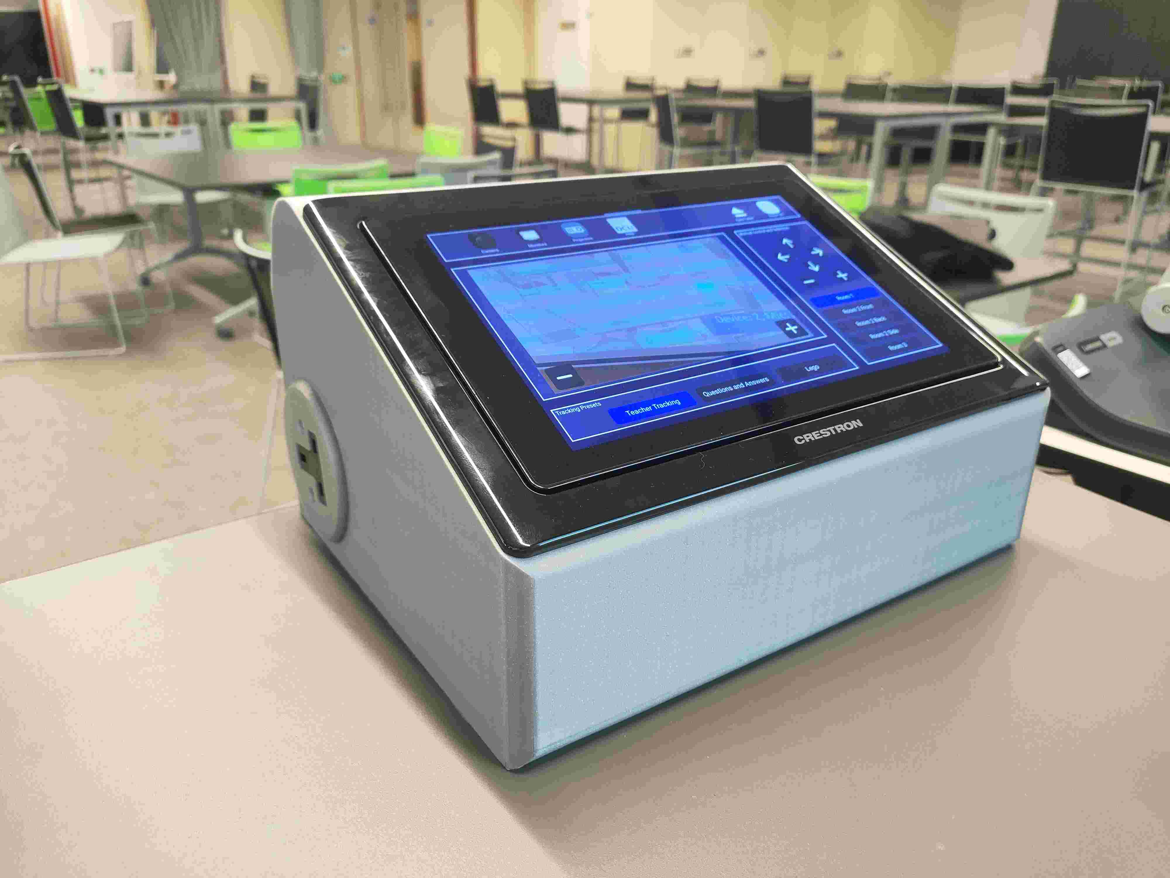 Crestron touchscreen control panel on a classroom lectern — the panel I built the 3D-printed dock and socket adapter for.
