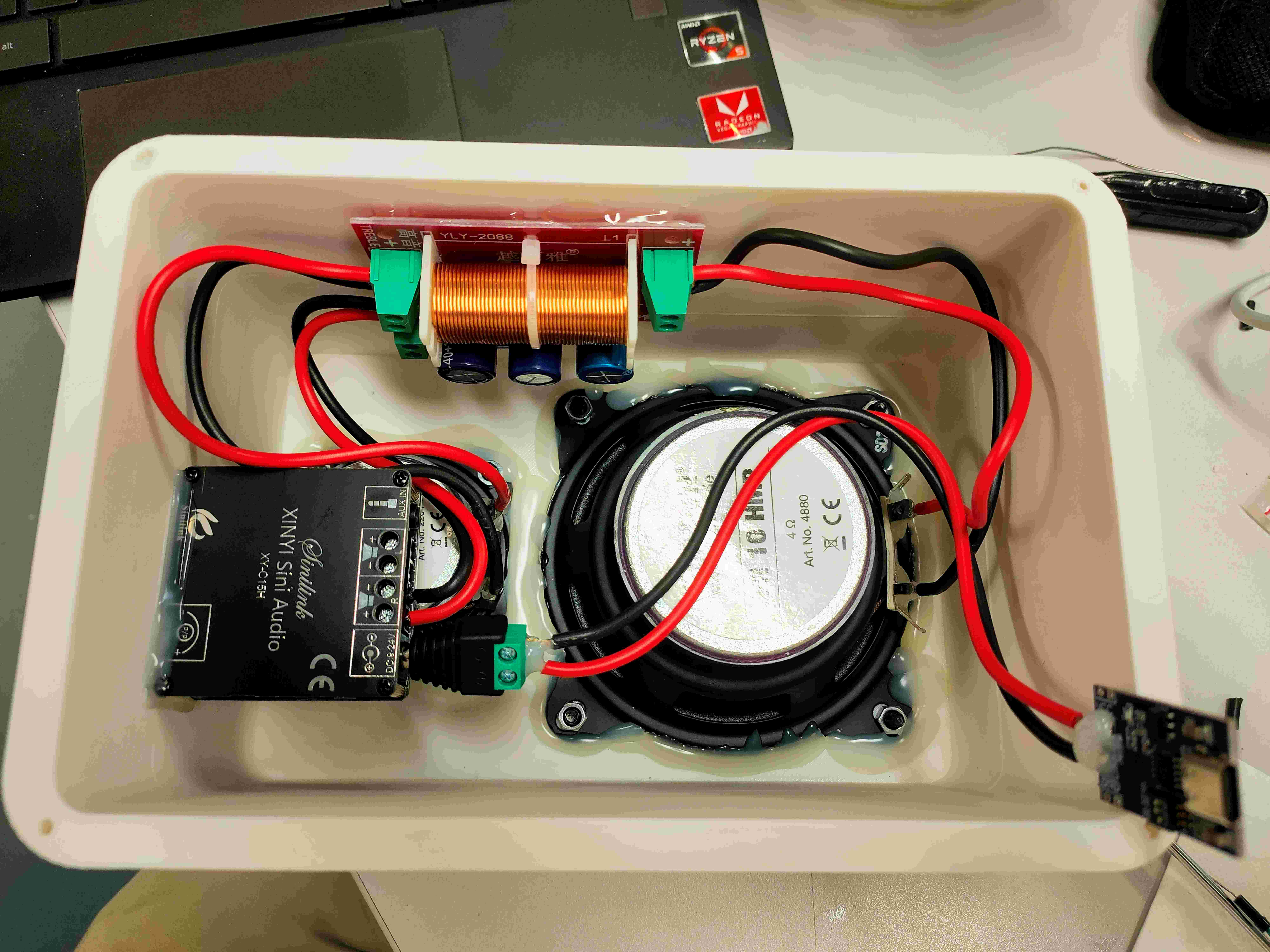 Speaker enclosure interior — YLY-2088 crossover board, XY-C15H Bluetooth amplifier module, 4 &Omega; driver secured with hot glue, and separated wiring.